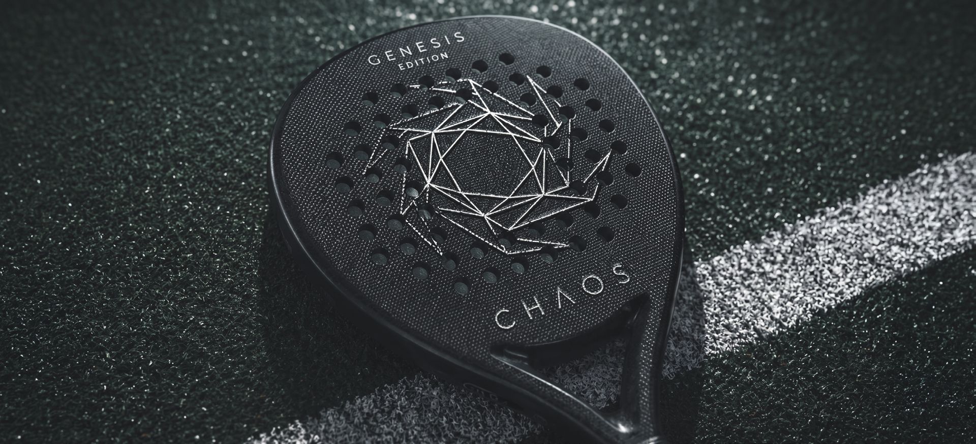 GENESIS racket resting on court